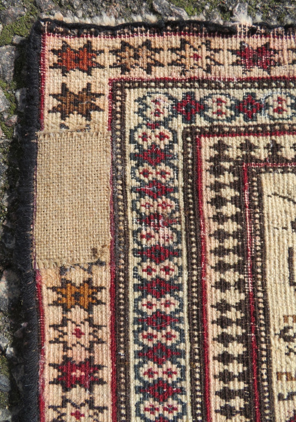 Hand-knotted wool Baluch prayer rug with a cream field featuring stylized camels, birds, hand symbols, and a mihrab top border. View X