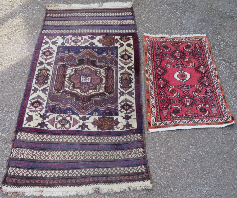 TWO RUGS. 150CM X 85CM. 77CM X 58CM.