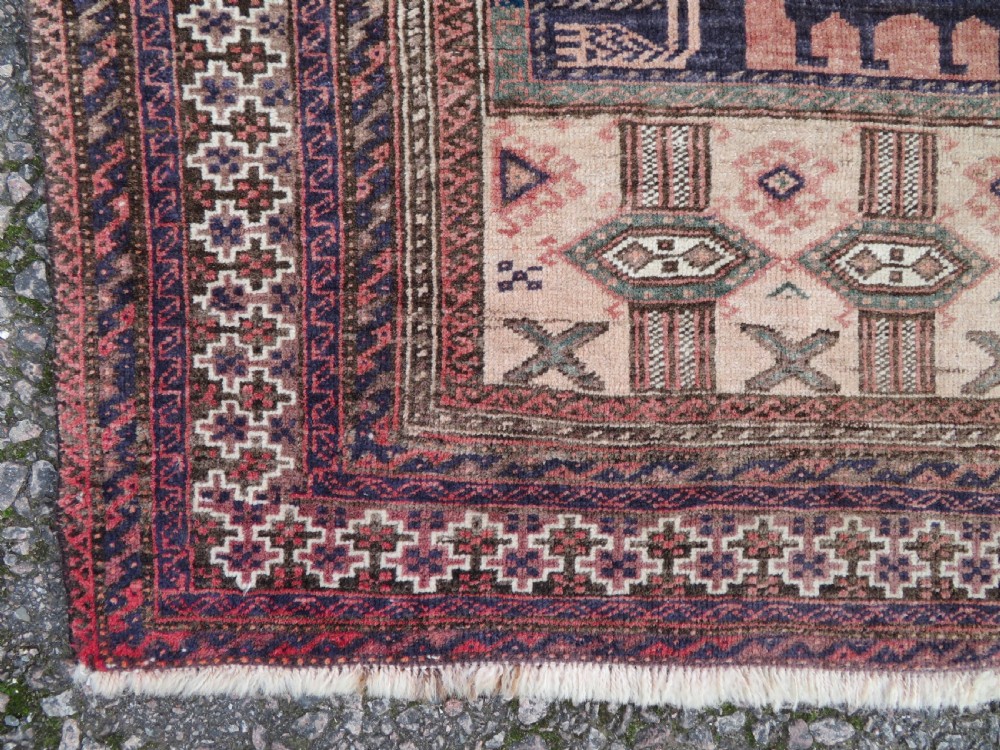 A hand-knotted Afghan wool rug featuring panelled sections with stylized animal motifs and geometric borders in terracotta, beige, brown, and navy blue hues. View XI
