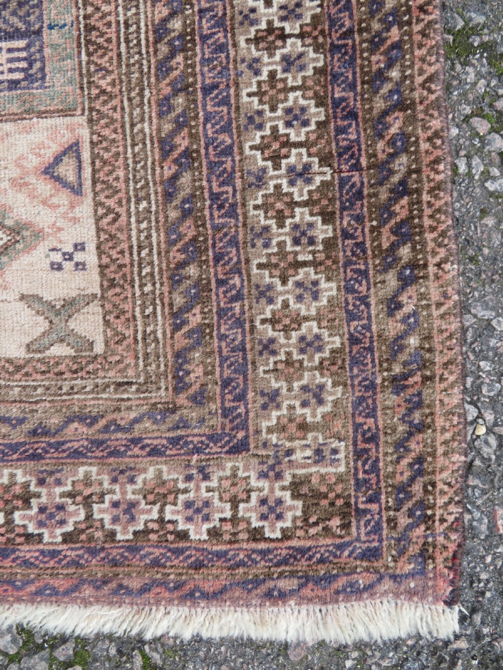 A hand-knotted Afghan wool rug featuring panelled sections with stylized animal motifs and geometric borders in terracotta, beige, brown, and navy blue hues. View XII