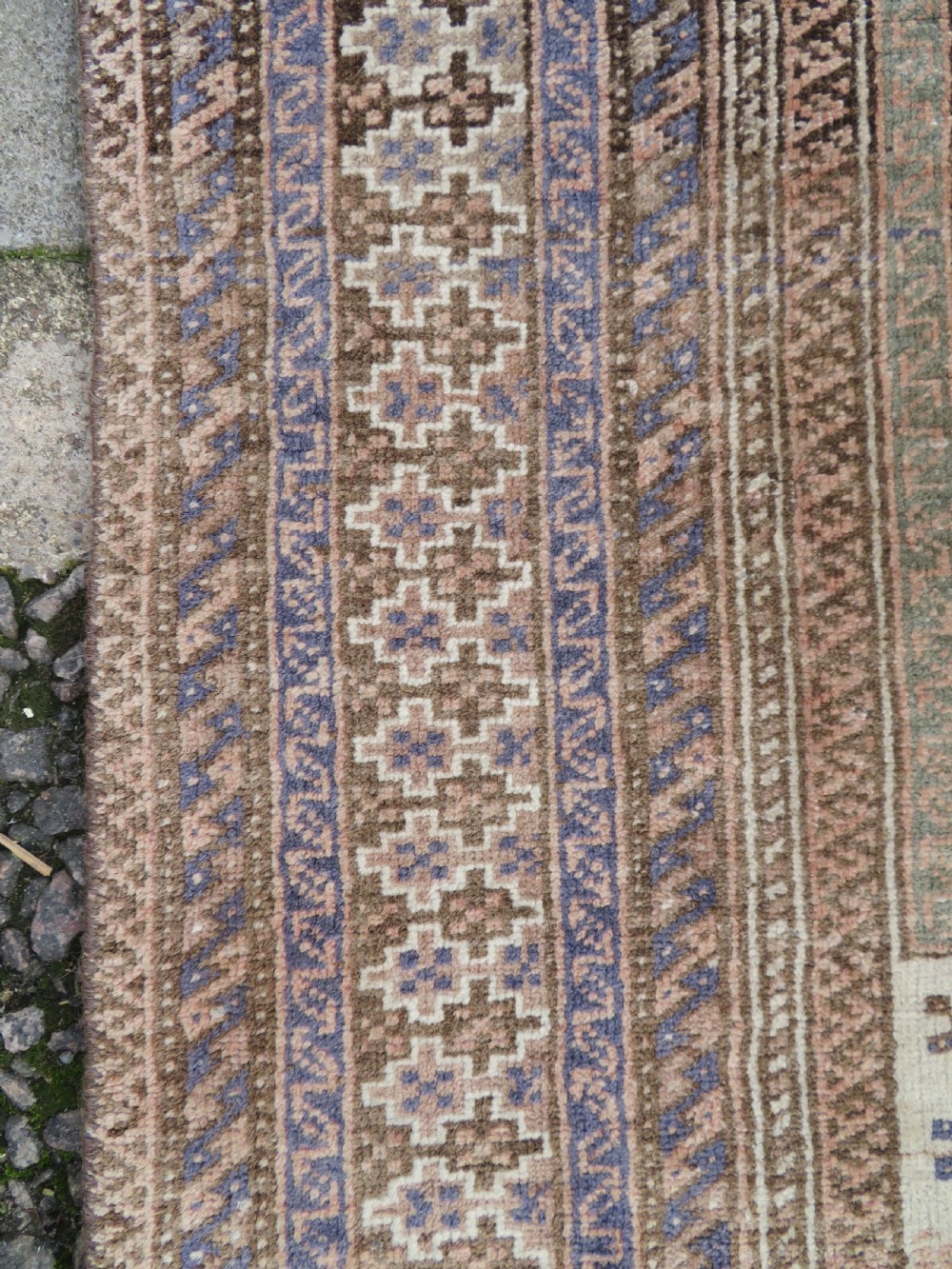 A hand-knotted Afghan wool rug featuring panelled sections with stylized animal motifs and geometric borders in terracotta, beige, brown, and navy blue hues. View XIII