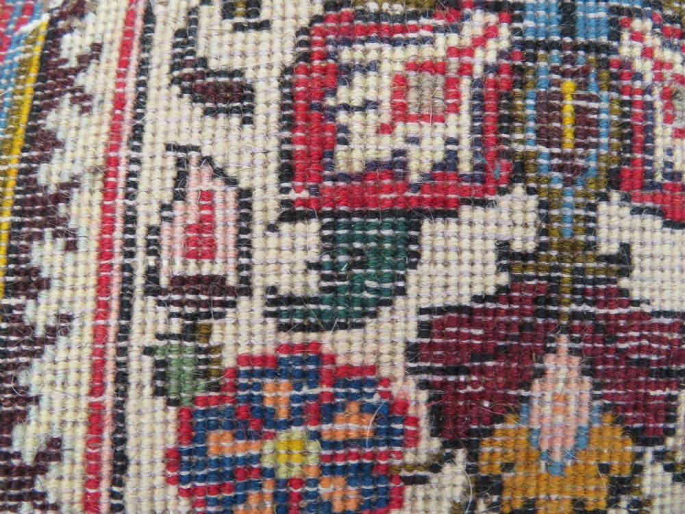 A large hand-knotted Persian Qum carpet with a square compartment panel design featuring floral and boteh motifs in red, blue, and cream enclosed by multi-band borders. View XV