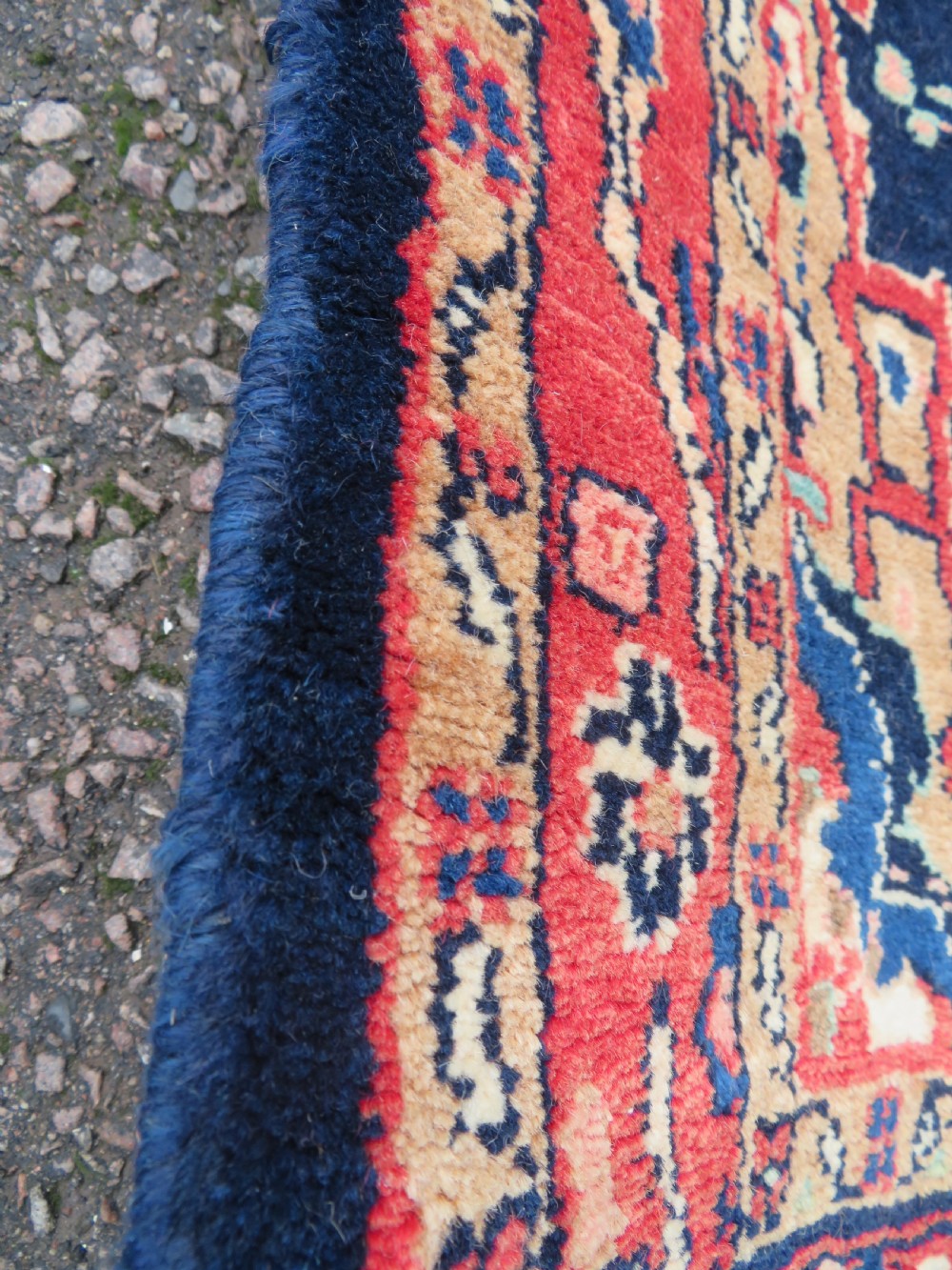An extra-long antique Persian Sarouk runner rug crafted in wool with navy blue, crimson red, and ivory floral medallion motifs. View XI