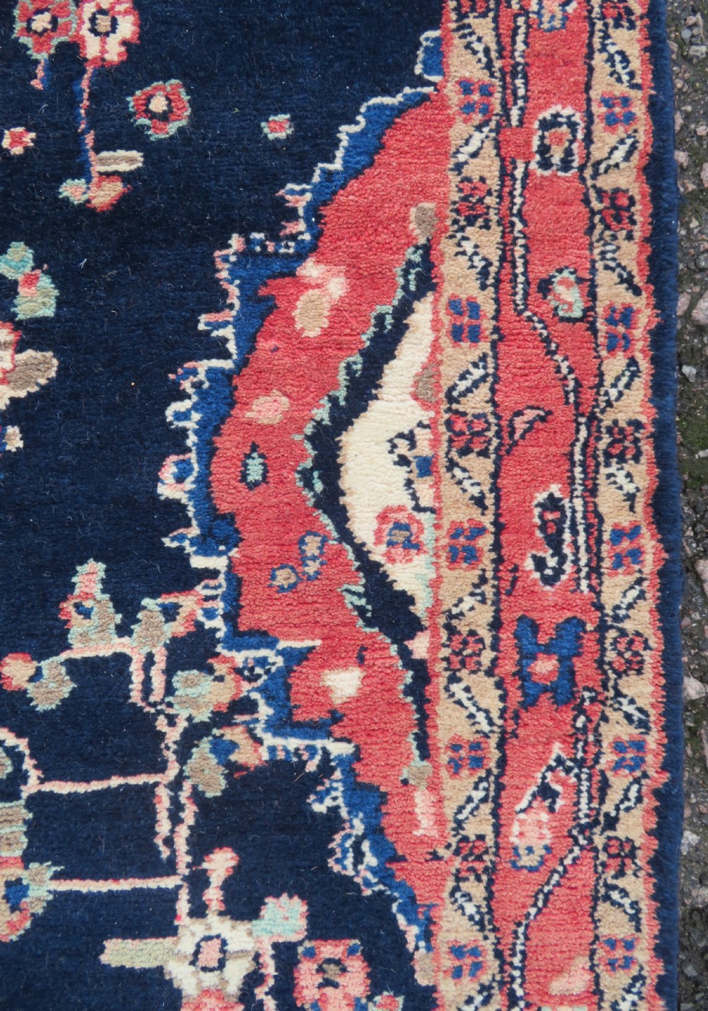 An extra-long antique Persian Sarouk runner rug crafted in wool with navy blue, crimson red, and ivory floral medallion motifs. View XIII
