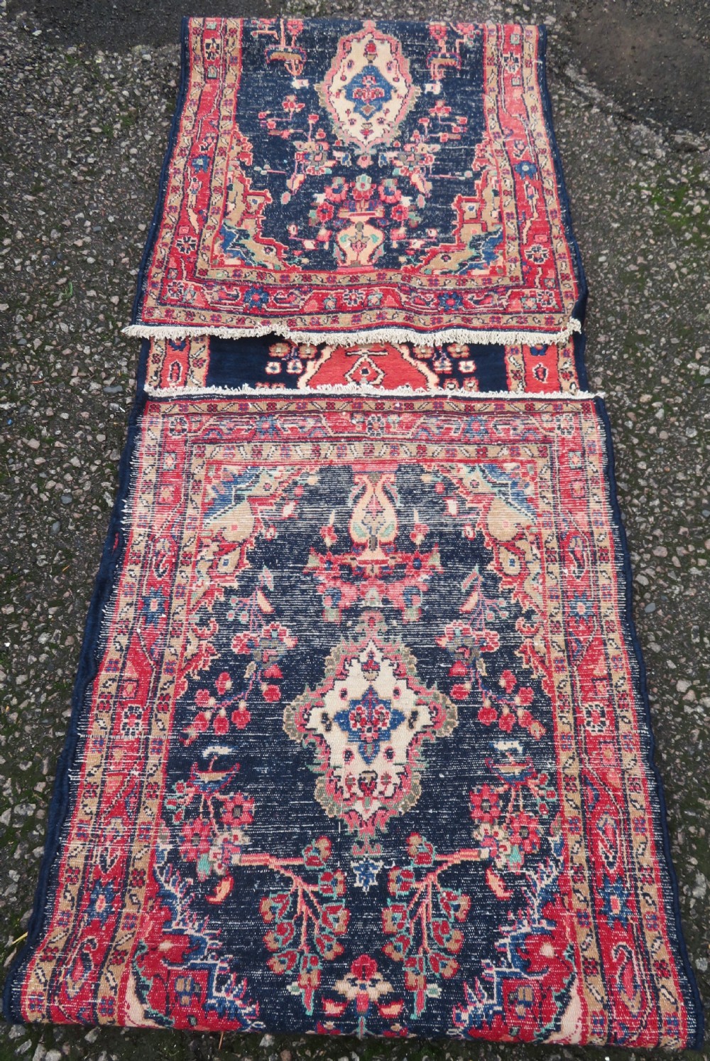 An extra-long antique Persian Sarouk runner rug crafted in wool with navy blue, crimson red, and ivory floral medallion motifs. View XVI
