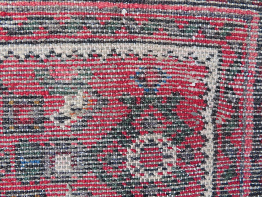 A long, narrow hand-knotted Persian Hamadan runner rug featuring a red field woven with geometric motifs and dark patterned borders. View XVIII