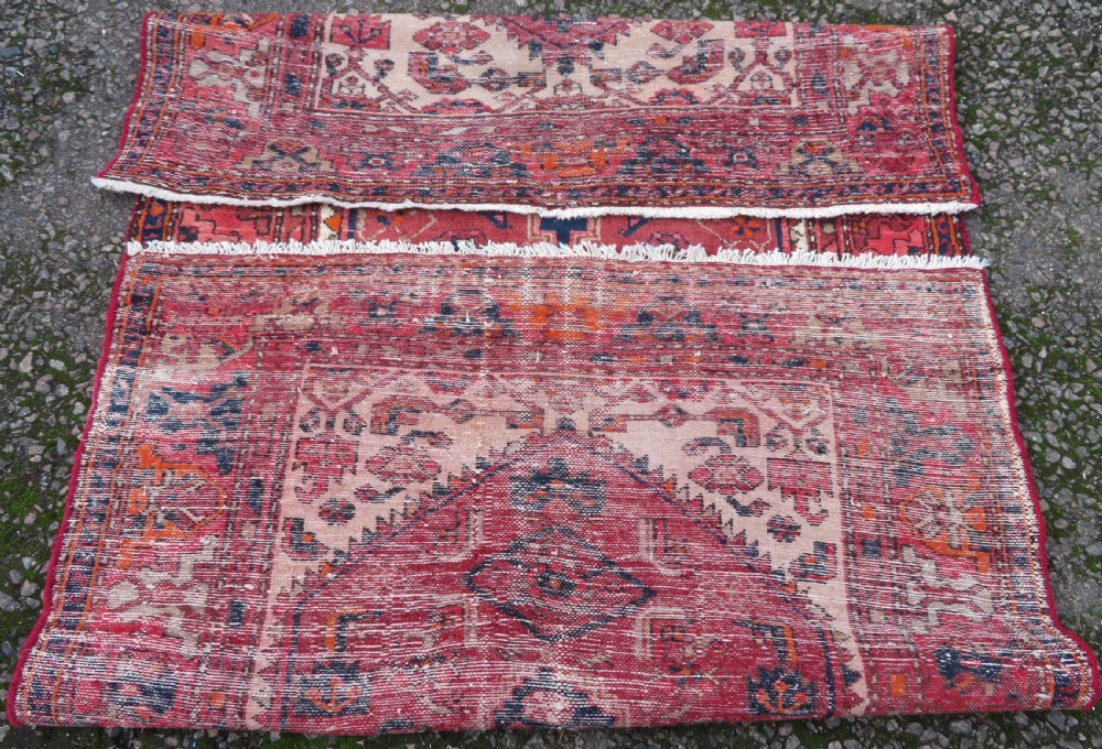 An antique Persian Malayer hand-knotted wool rug featuring a red central field, stepped navy medallion, ivory spandrels, and geometric floral borders. View XV