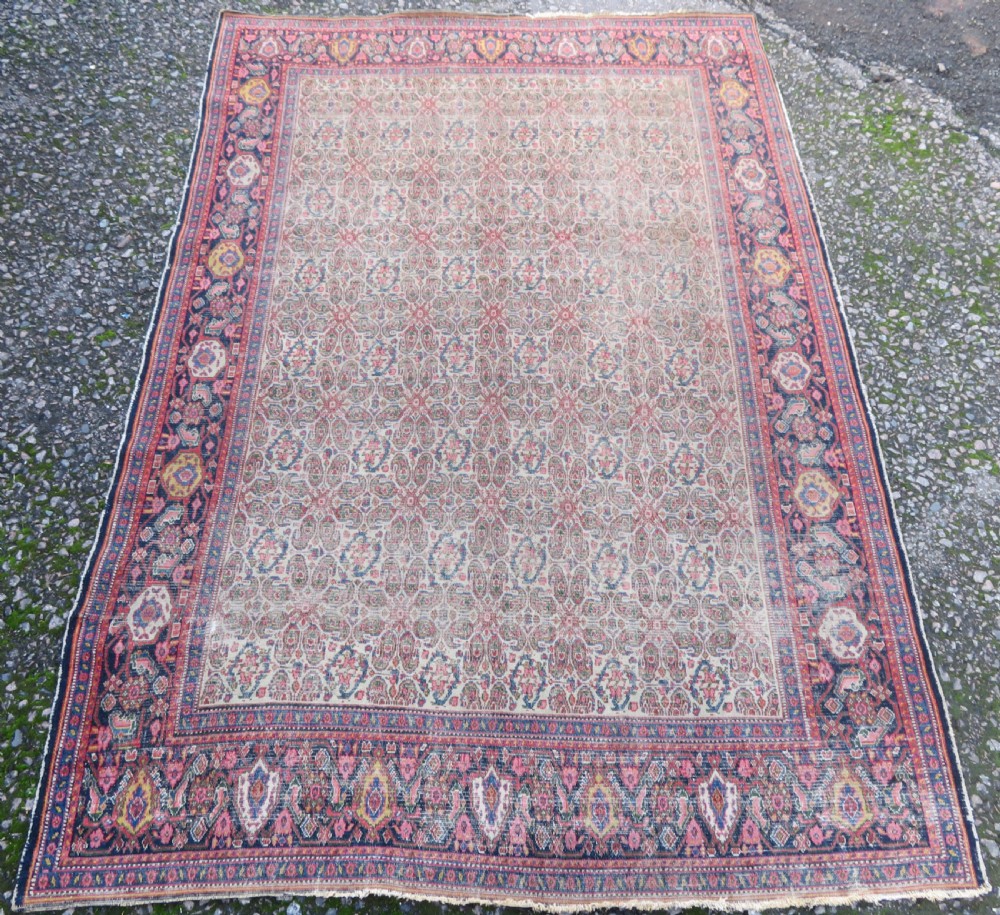 A nineteenth-century Persian Fereghan wool rug featuring an intricate all-over floral lattice pattern framed by navy and terracotta borders. View II