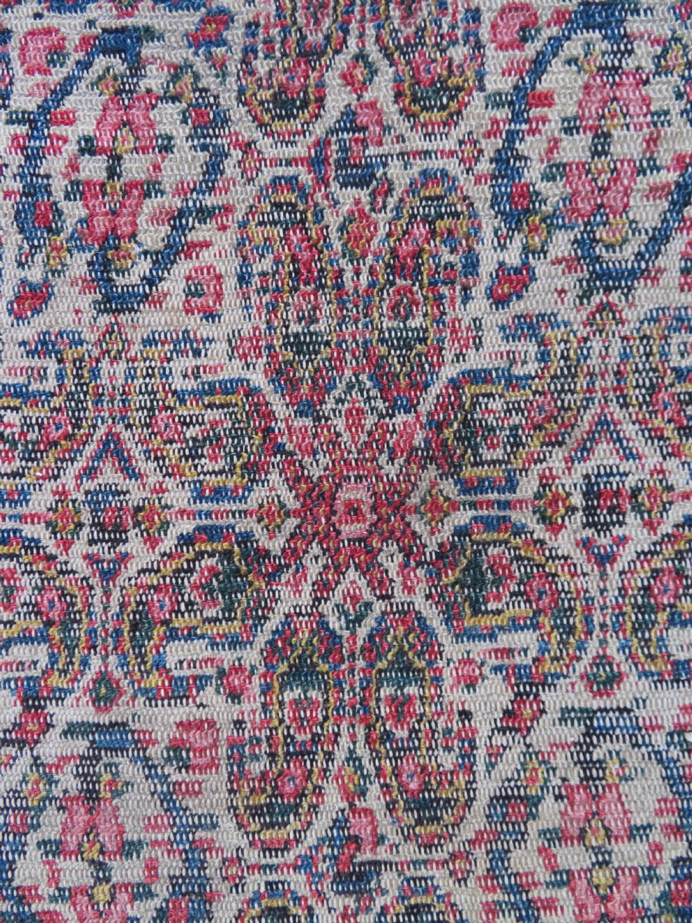 A nineteenth-century Persian Fereghan wool rug featuring an intricate all-over floral lattice pattern framed by navy and terracotta borders. View V