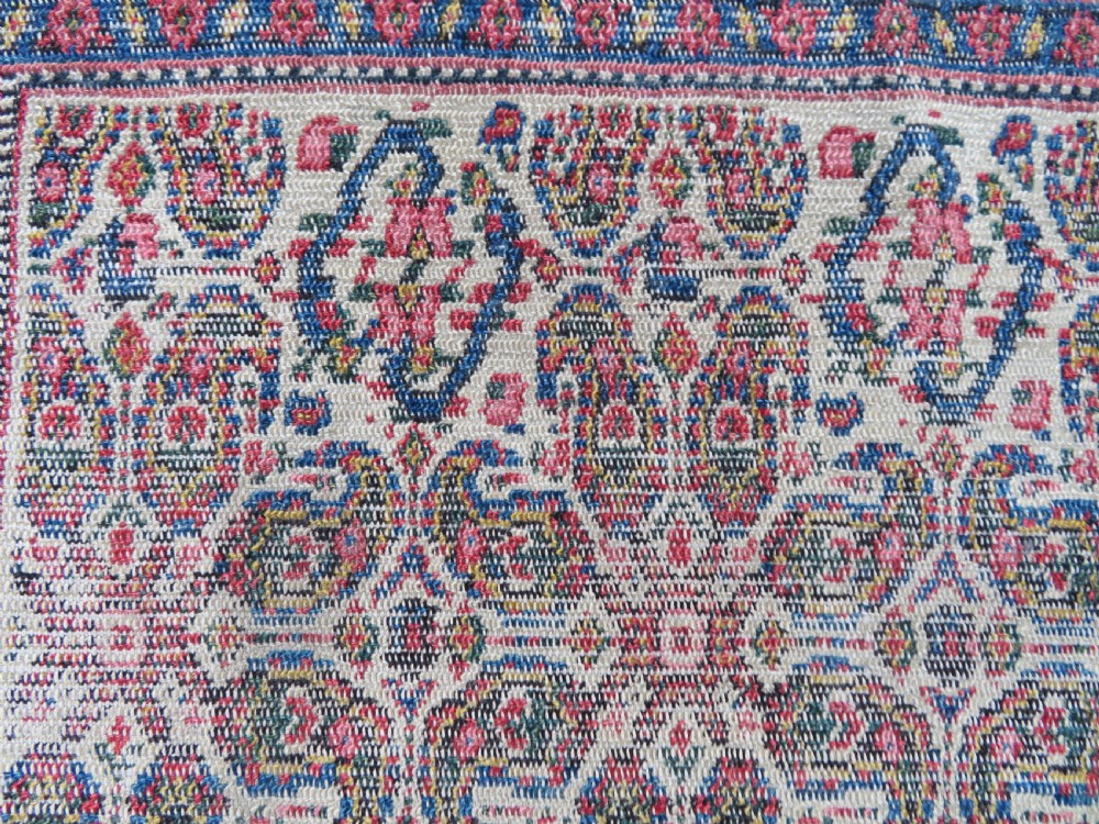 A nineteenth-century Persian Fereghan wool rug featuring an intricate all-over floral lattice pattern framed by navy and terracotta borders. View VI