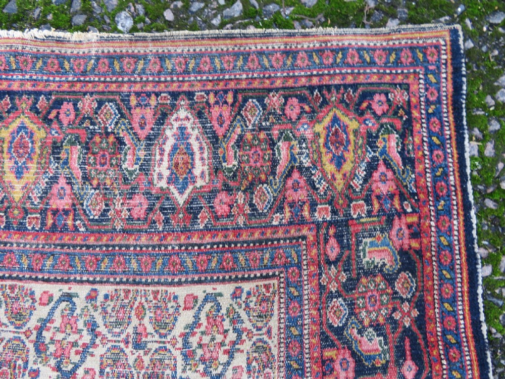 A nineteenth-century Persian Fereghan wool rug featuring an intricate all-over floral lattice pattern framed by navy and terracotta borders. View XI