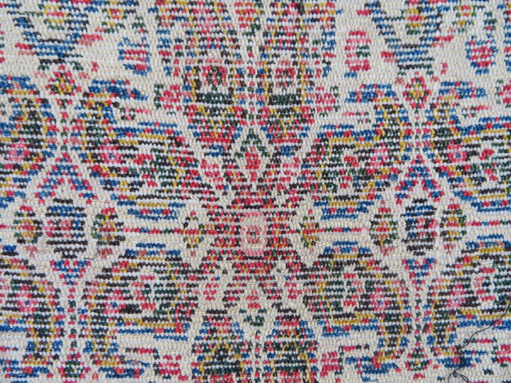 A nineteenth-century Persian Fereghan wool rug featuring an intricate all-over floral lattice pattern framed by navy and terracotta borders. View XVII