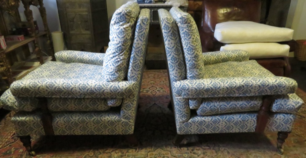 PAIR HOWARD AND SONS OPEN ARMCHAIRS. View II