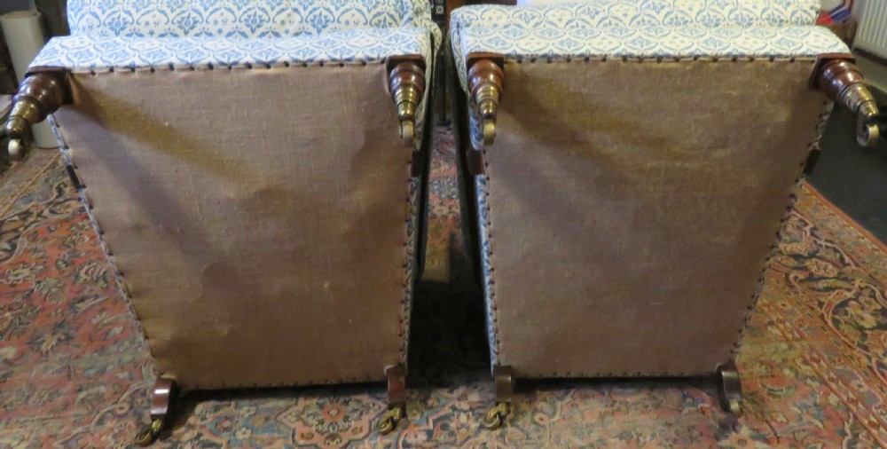 PAIR HOWARD AND SONS OPEN ARMCHAIRS. View VIII