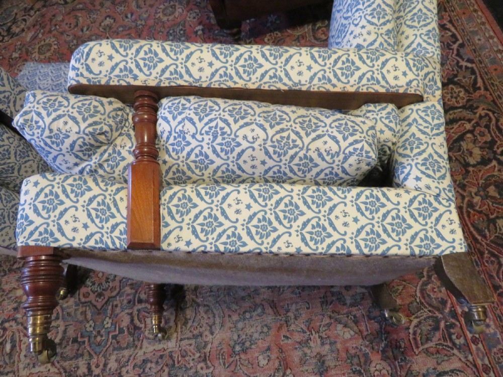 PAIR HOWARD AND SONS OPEN ARMCHAIRS. View XI