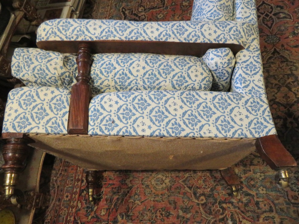 PAIR HOWARD AND SONS OPEN ARMCHAIRS. View XIII