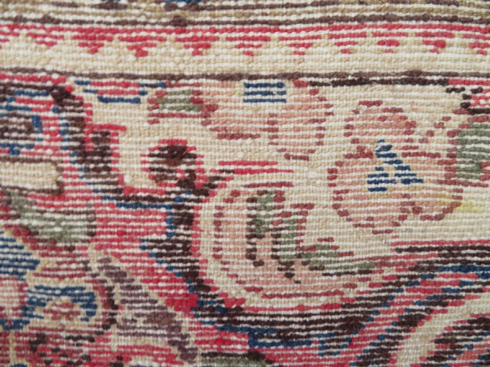 A large rectangular hand-knotted Persian Hamadan wool rug featuring a central floral medallion surrounded by intricate floral motifs in shades of rose pink, cream, brown, and blue. View XVI