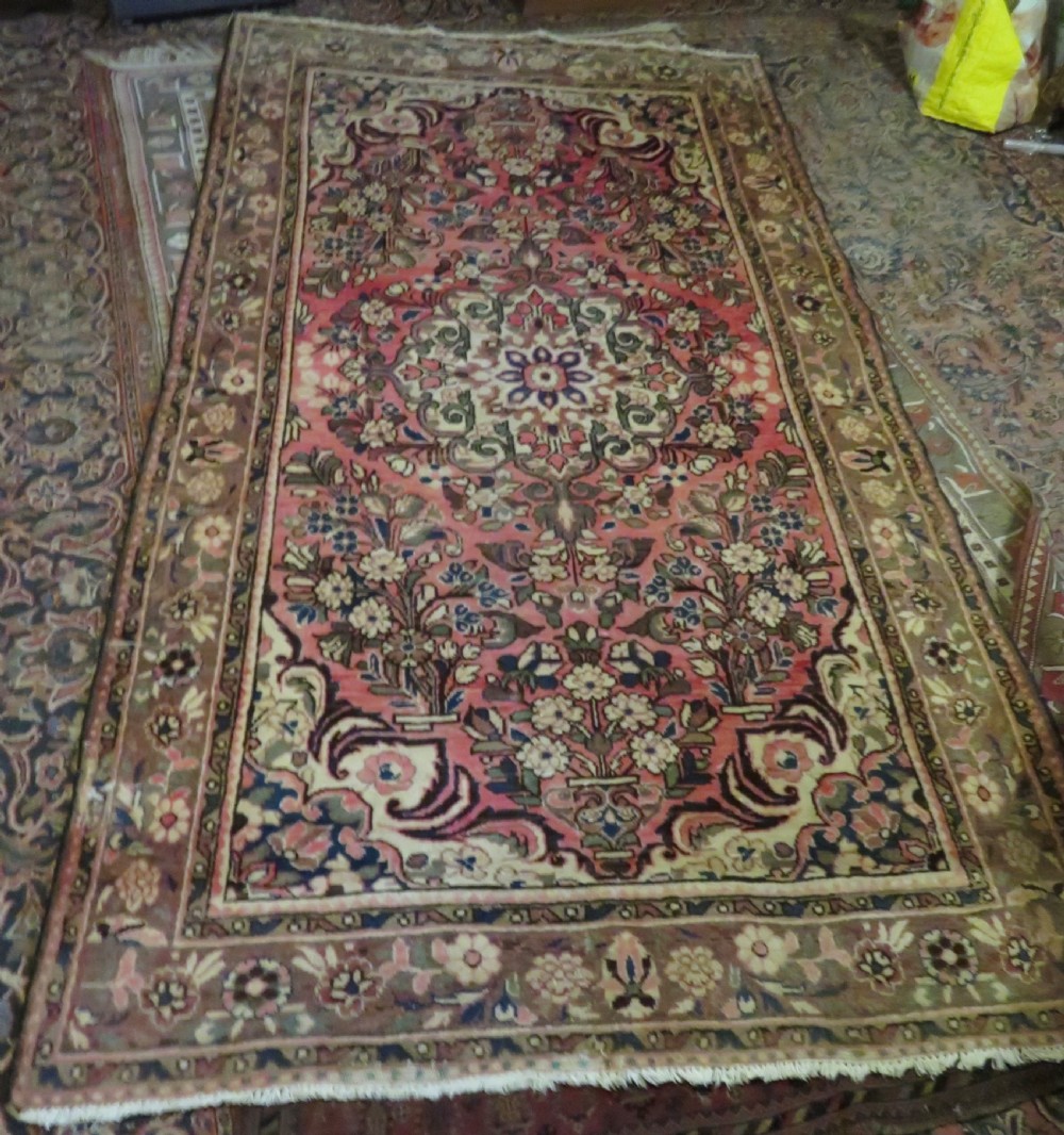 A large rectangular hand-knotted Persian Hamadan wool rug featuring a central floral medallion surrounded by intricate floral motifs in shades of rose pink, cream, brown, and blue. View XVII