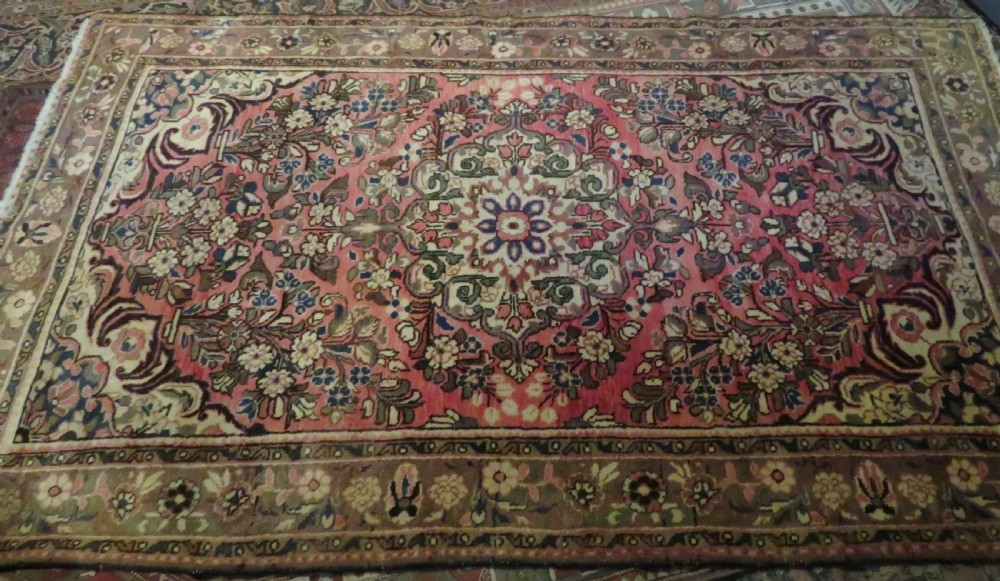 A large rectangular hand-knotted Persian Hamadan wool rug featuring a central floral medallion surrounded by intricate floral motifs in shades of rose pink, cream, brown, and blue. View XVIII