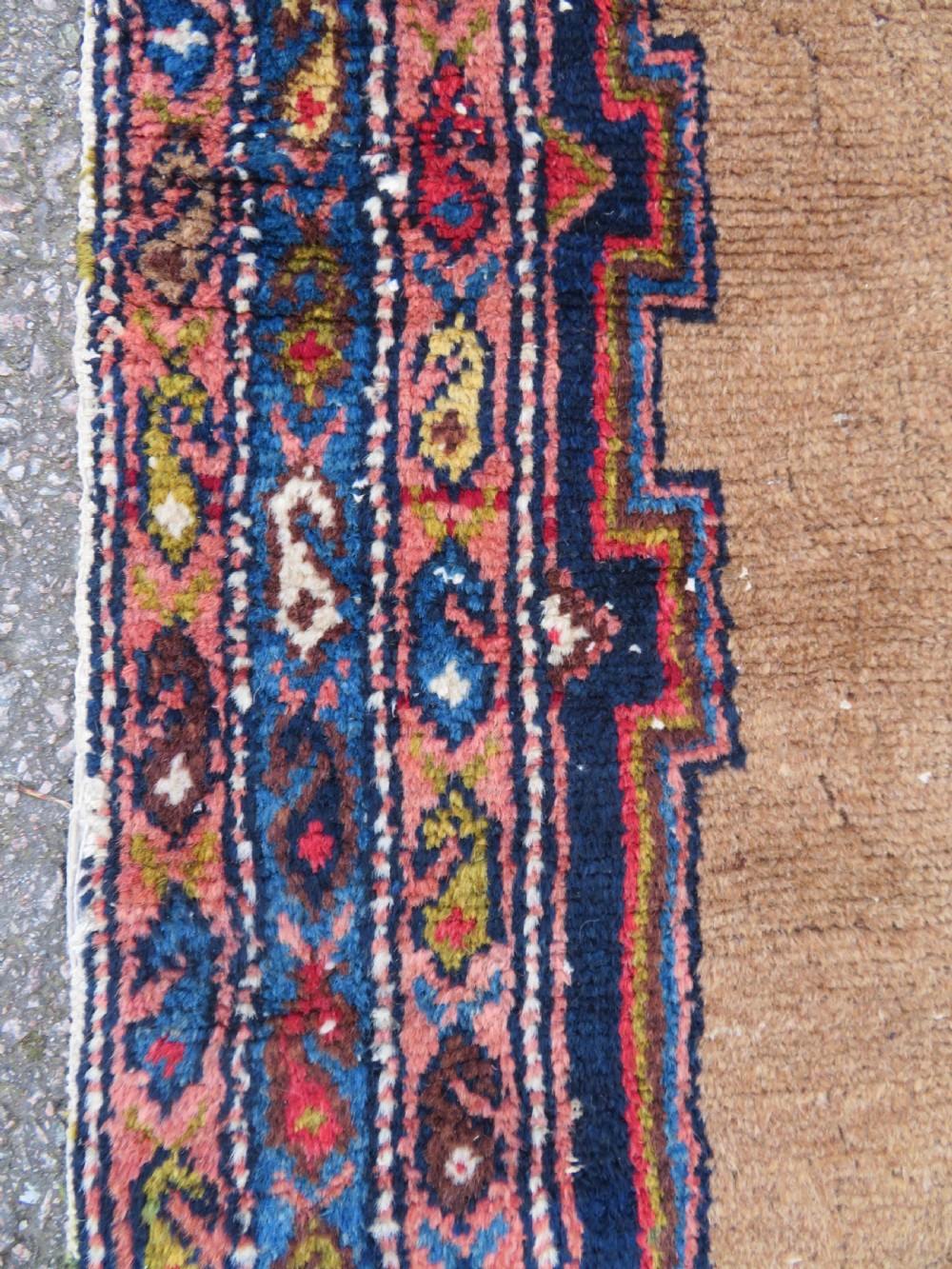 An antique hand-knotted Persian Hamadan wool rug featuring a geometric central medallion on a camel field with navy and red accents. View VII