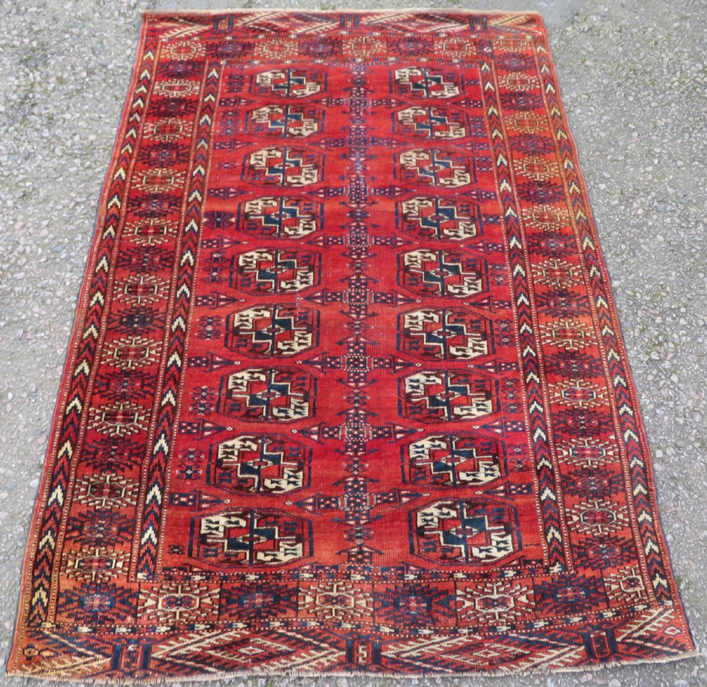 Distressed Antique Tekke Turkmen Rug. 183cm x 126cm.