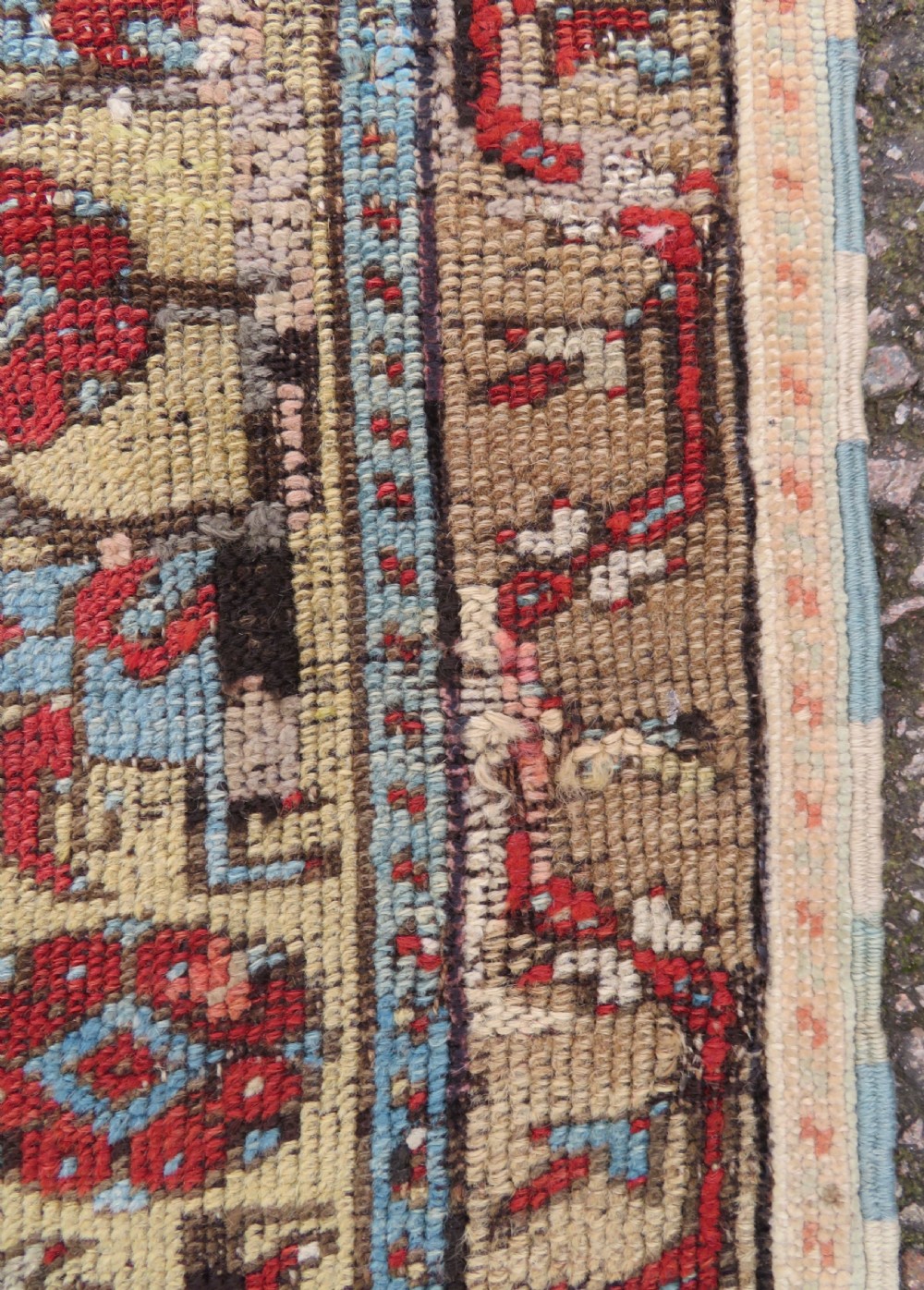 An antique hand-knotted Turkish Ladik wool prayer rug featuring a central pale blue mihrab niche, inverted tulip motifs, and multi-coloured geometric borders. View XIII