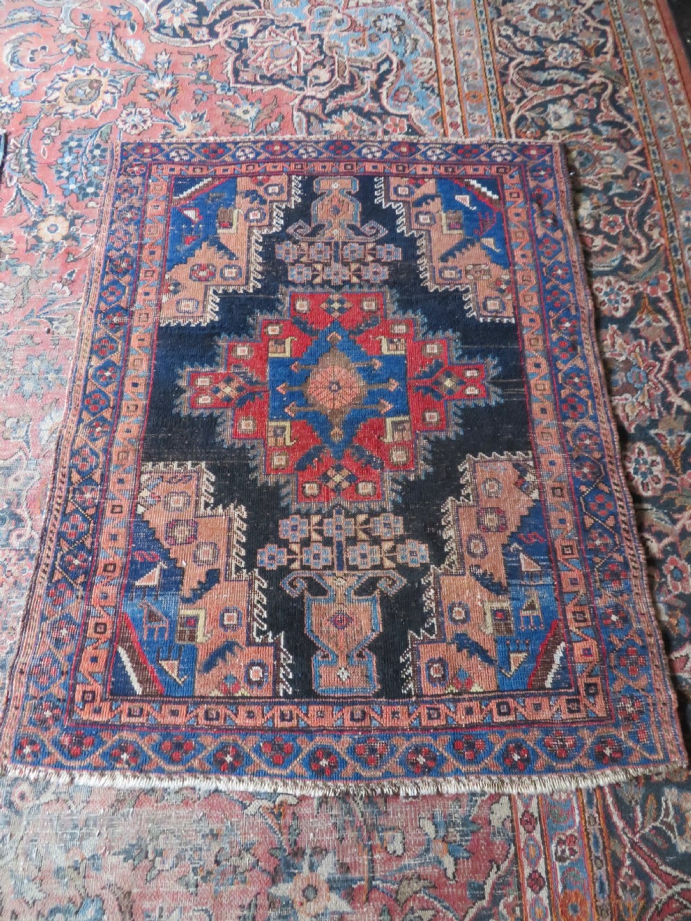 An antique hand-knotted Afshar wool rug featuring a central stepped geometric medallion in rust red and blue framed by intricate tribal borders. View XI