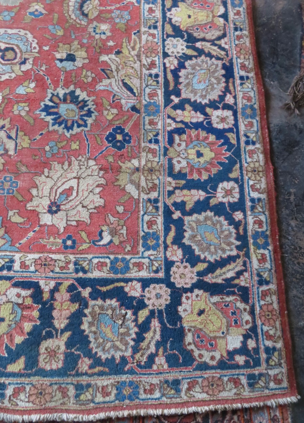 An antique hand-knotted Tabriz wool carpet featuring a central navy and cream medallion on a terracotta field with intricate floral borders. View VIII