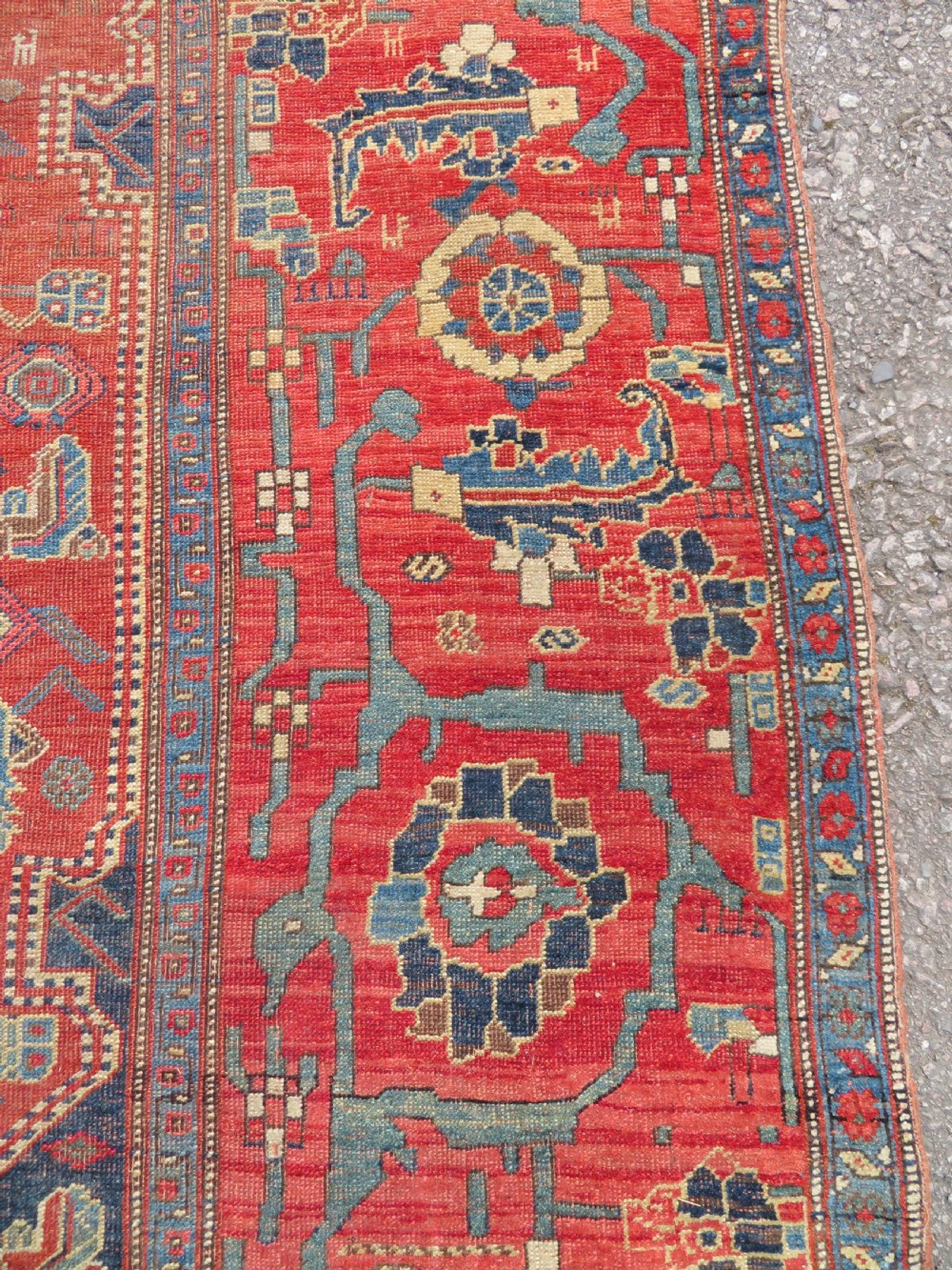 An antique Kurdish Bidjar Kelleh hand-knotted carpet featuring geometric diamond medallions on a terracotta red field with dark navy blue borders. View XIII
