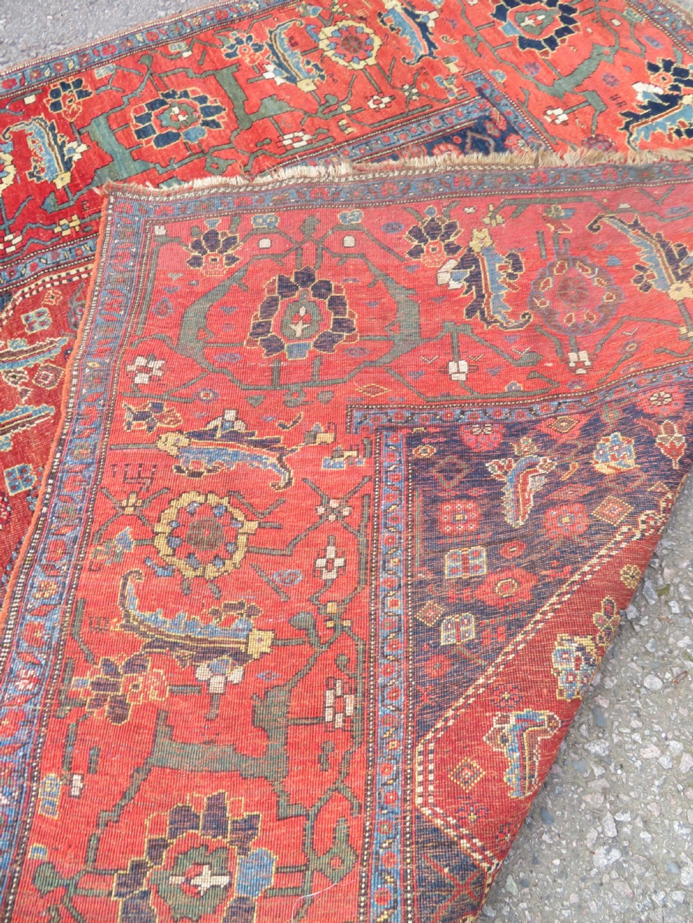An antique Kurdish Bidjar Kelleh hand-knotted carpet featuring geometric diamond medallions on a terracotta red field with dark navy blue borders. View XXIX