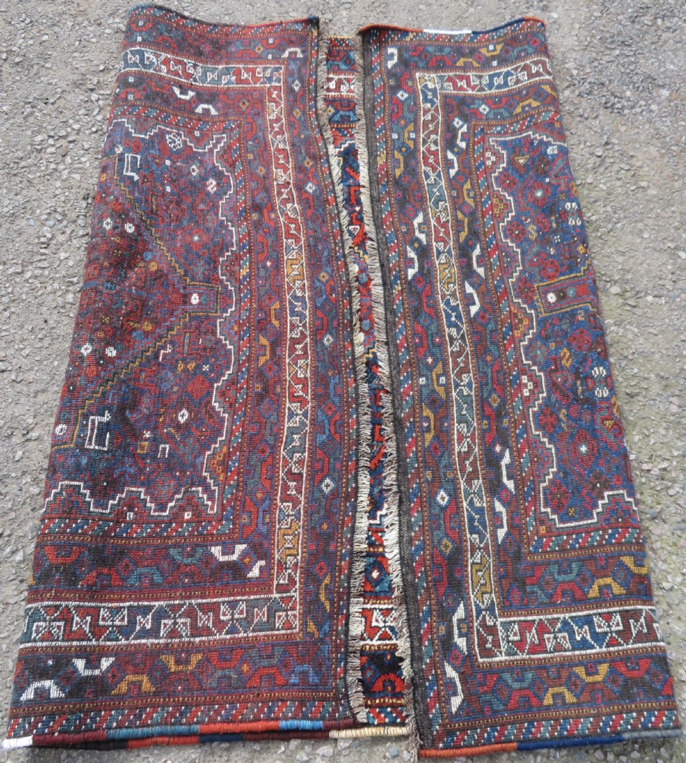 An antique Khamseh hand-knotted wool tribal rug featuring three central diamond medallions surrounded by small bird and geometric motifs in deep blue, terracotta red, and cream. View XVII