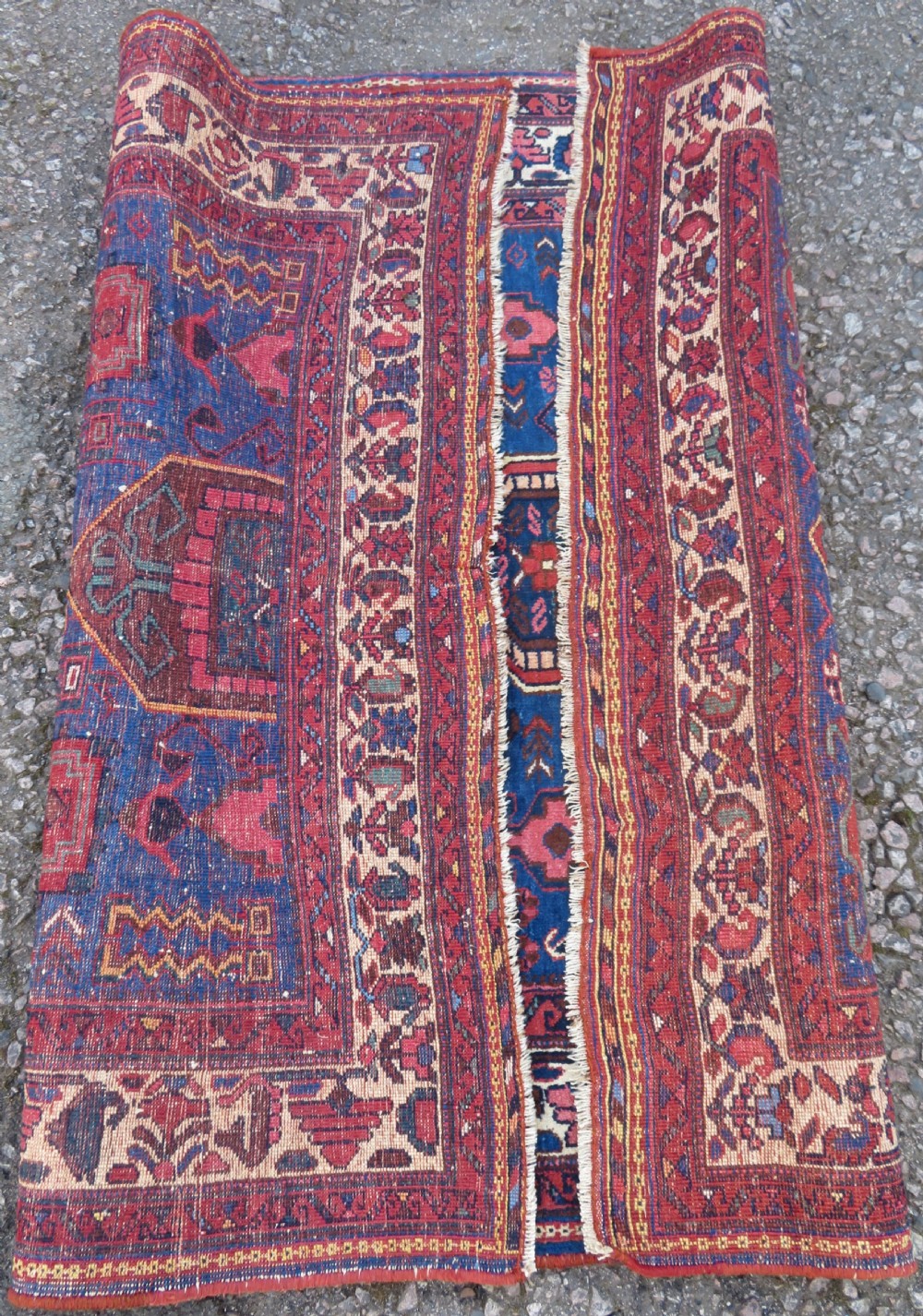 An antique hand-knotted Afshar wool rug featuring a vibrant indigo blue central field with stylized geometric medallions surrounded by detailed terracotta red and ivory borders. View XII