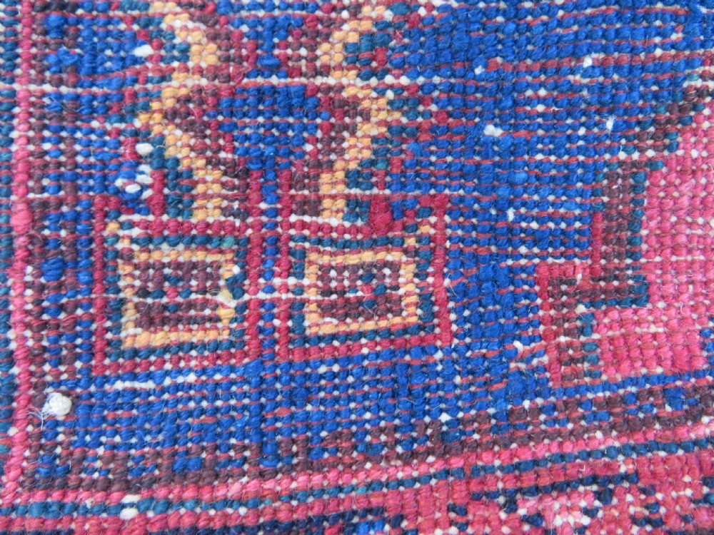 An antique hand-knotted Afshar wool rug featuring a vibrant indigo blue central field with stylized geometric medallions surrounded by detailed terracotta red and ivory borders. View XIV