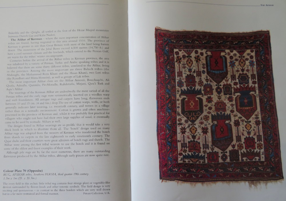 An antique hand-knotted Afshar wool rug featuring a vibrant indigo blue central field with stylized geometric medallions surrounded by detailed terracotta red and ivory borders. View XVI