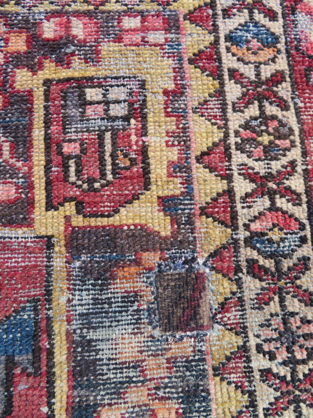 An antique hand-knotted wool Persian Malayer rug featuring a central geometric medallion on a cream and terracotta red field with multi-tiered borders. View IV
