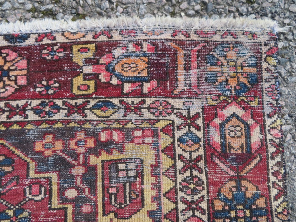 An antique hand-knotted wool Persian Malayer rug featuring a central geometric medallion on a cream and terracotta red field with multi-tiered borders. View VI