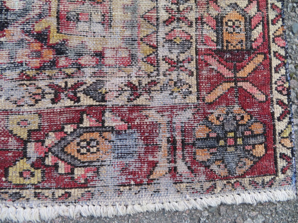 An antique hand-knotted wool Persian Malayer rug featuring a central geometric medallion on a cream and terracotta red field with multi-tiered borders. View VII
