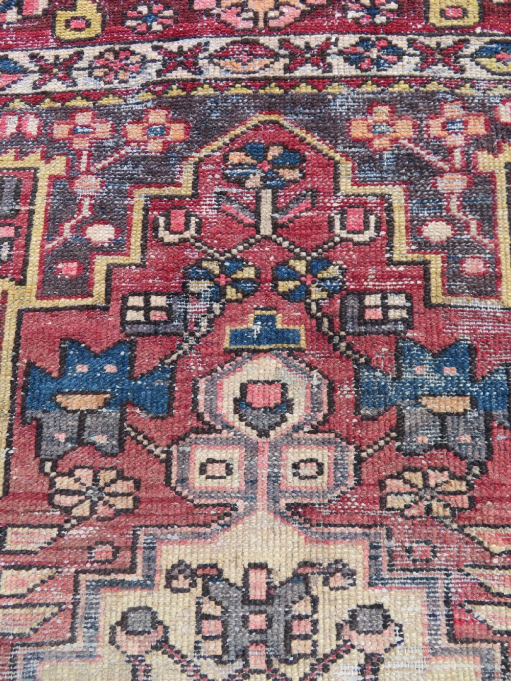 An antique hand-knotted wool Persian Malayer rug featuring a central geometric medallion on a cream and terracotta red field with multi-tiered borders. View XII