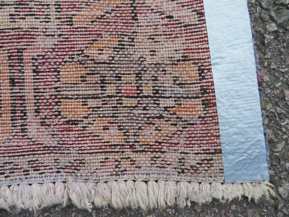 An antique hand-knotted wool Persian Malayer rug featuring a central geometric medallion on a cream and terracotta red field with multi-tiered borders. View XIV