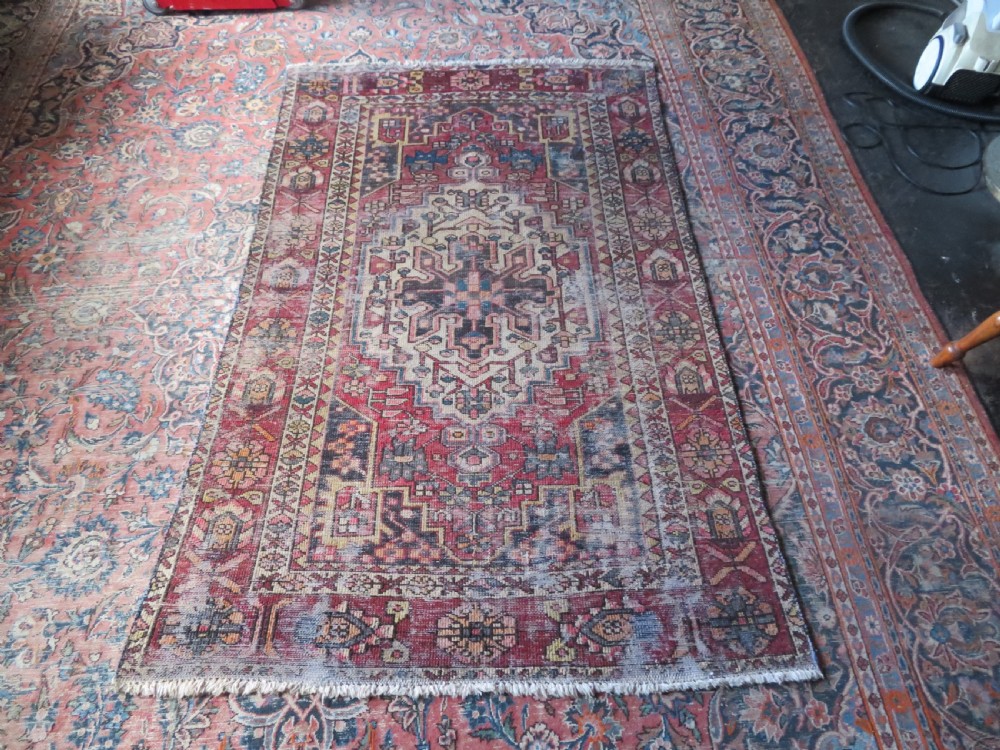 An antique hand-knotted wool Persian Malayer rug featuring a central geometric medallion on a cream and terracotta red field with multi-tiered borders. View XIX
