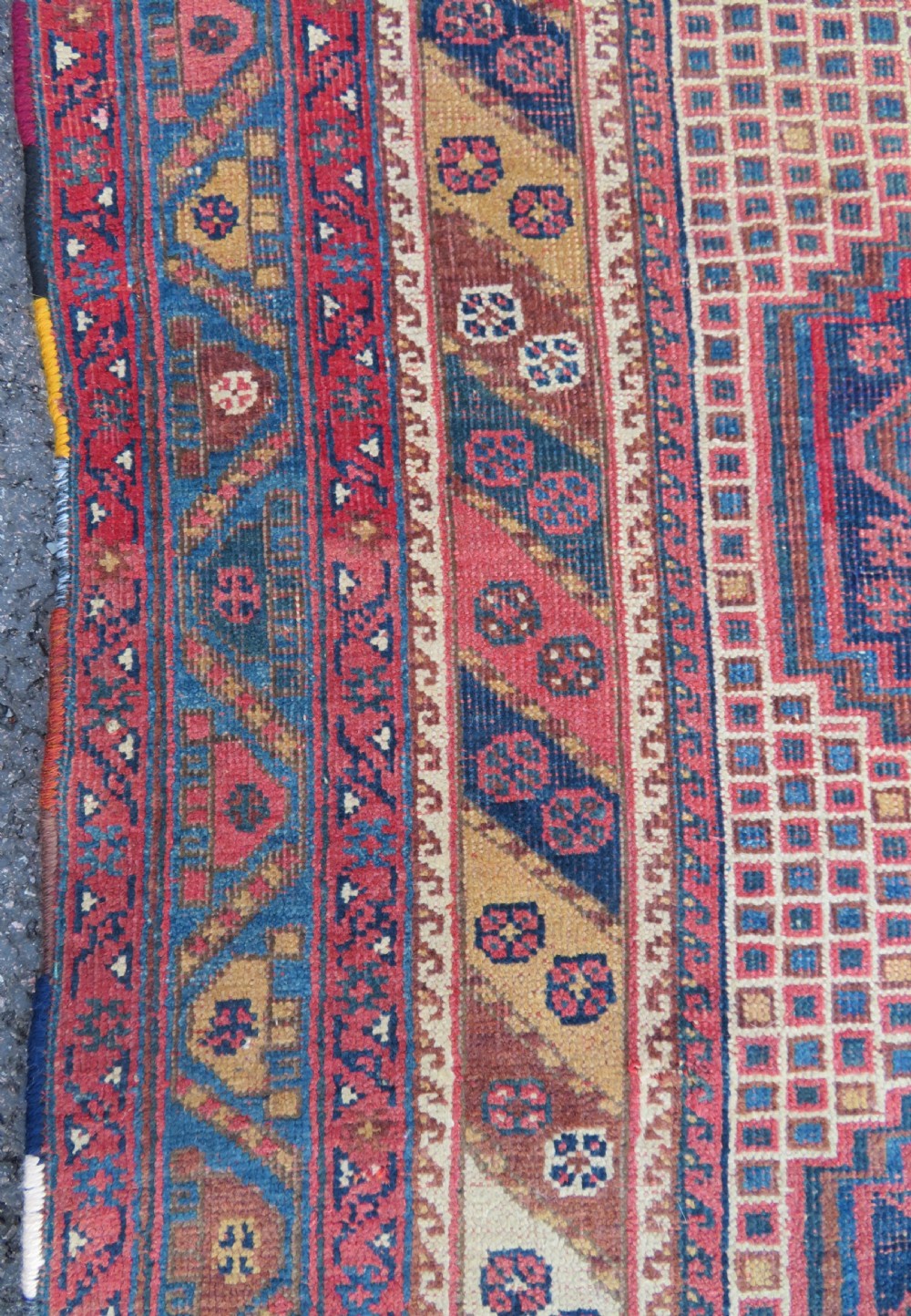 An antique Khamseh hand-knotted wool rug featuring five central diamond medallions on a dark navy and red field decorated with tribal bird motifs. View XIV