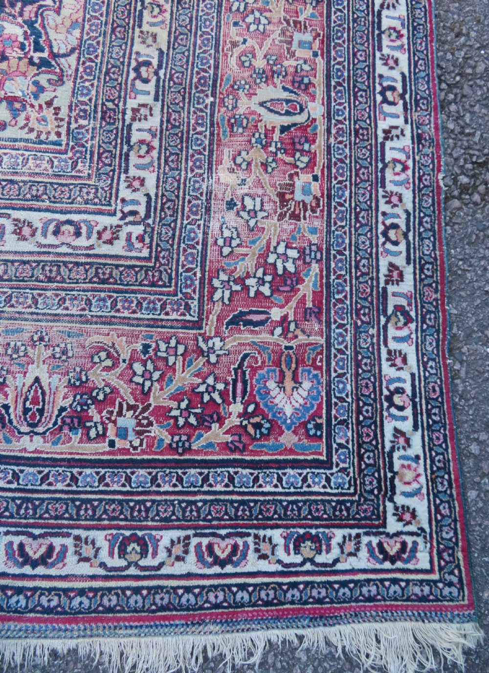 An antique hand-knotted Meshed Persian wool carpet featuring a central navy blue medallion on a distressed rose pink field surrounded by intricate floral borders. View XIII