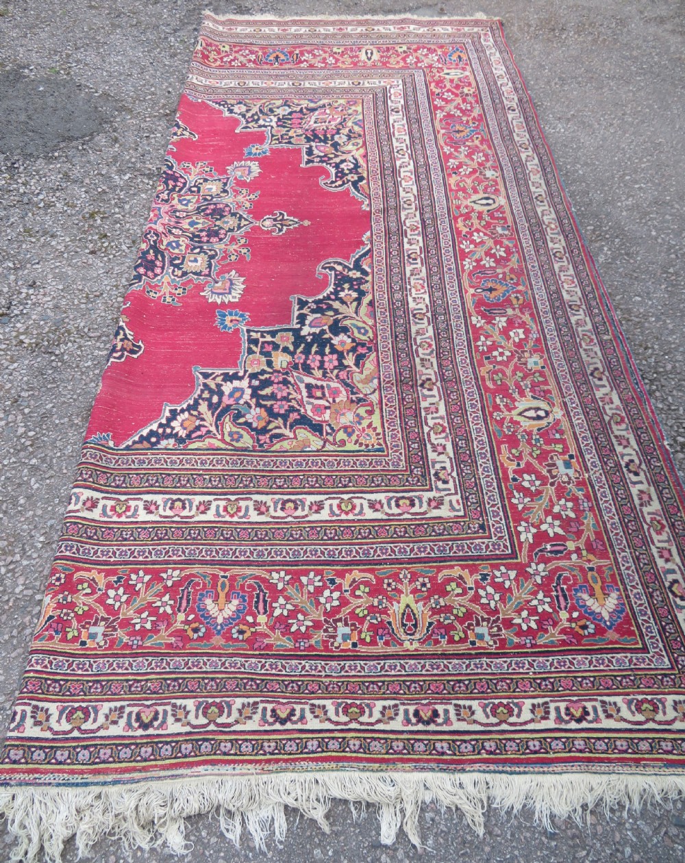 An antique hand-knotted Meshed Persian wool carpet featuring a central navy blue medallion on a distressed rose pink field surrounded by intricate floral borders. View XXIII