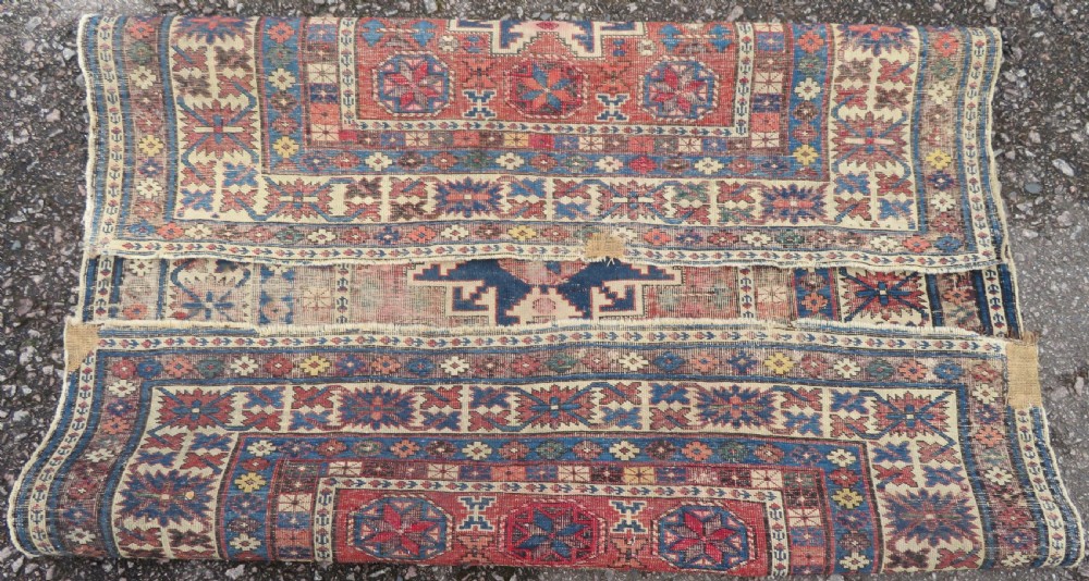 DISTRESSED ANTIQUE CAUCASIAN DAGHESTAN RUG. 135CM X 116CM View X