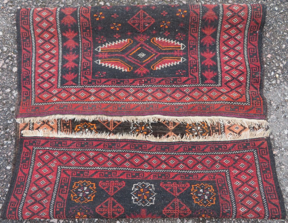 A hand-woven wool Afghan prayer rug featuring a dark brown central field with terracotta geometric motifs and a distinct pointed arch design. View VIII