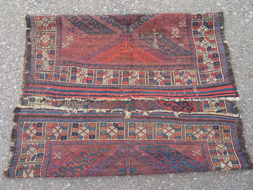 A rectangular distressed Persian Khamseh rug featuring repeating central diamond medallions in indigo blue and terracotta red surrounded by detailed geometric border bands. View VIII