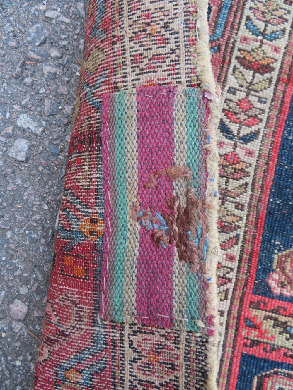 An antique hand-knotted North West Persian long rug featuring five geometric central medallions set against a dark field with a red pattern border. View VI