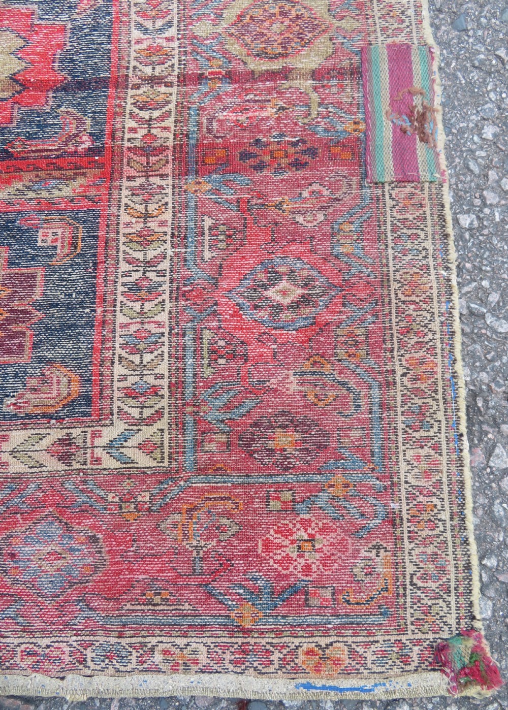 An antique hand-knotted North West Persian long rug featuring five geometric central medallions set against a dark field with a red pattern border. View XV