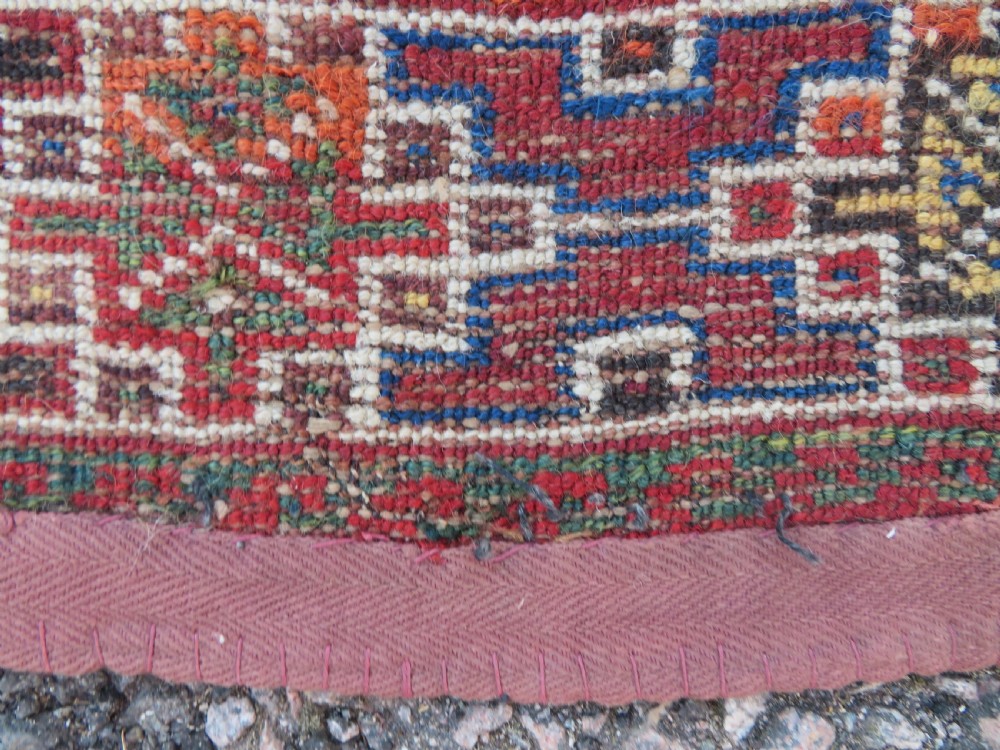 An antique Khamseh hand-knotted wool rug featuring three stacked geometric diamond medallions on an indigo blue field surrounded by intricate patterned borders. View XVI