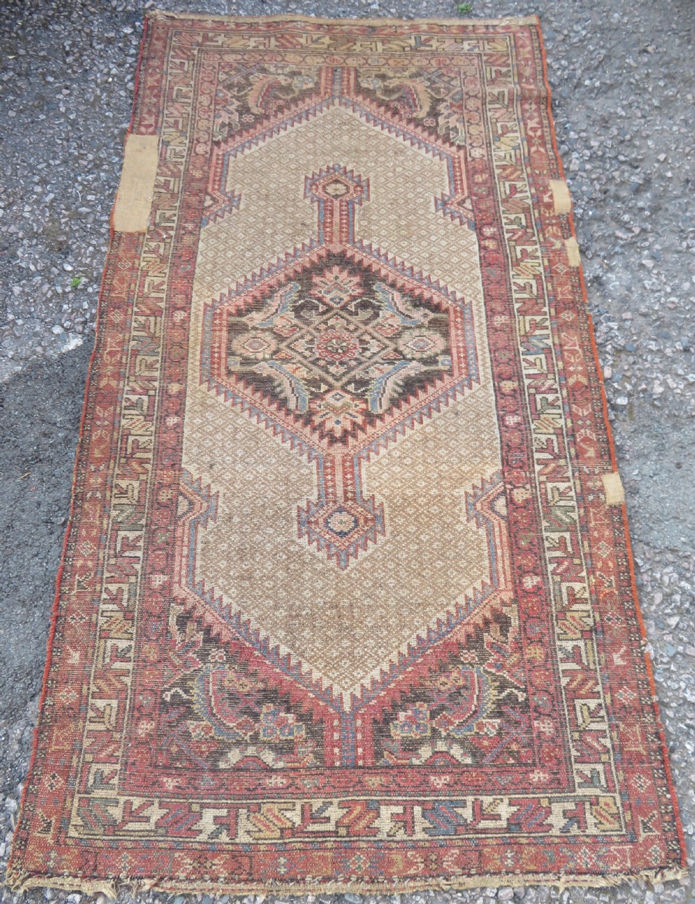 An antique hand-knotted Sarab rug with a geometric central medallion, camel hair field, and distressed terracotta borders. View XIII